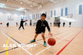 Pupils play basketball in the new sports hall (©AAH/Alan Wright)