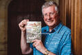 Michael Burt with his book on village history
