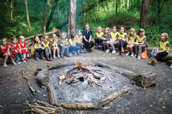 Brownies and rainbows around a campfire