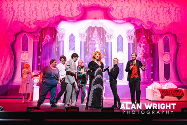 Cameron Rowell as the flamboyant Roger Debris (in the dress)  and his assistant Carmen Ghia, played by Sam Berry (black jeans)  ©AAH/Alan Wright)