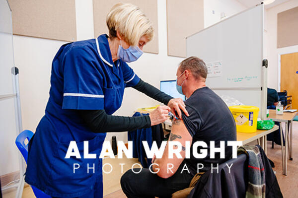 Nurse Suzanne Bunch administers a booster jab (©AAH/Alan Wright) Nurse Suzanne Bunch administers a booster jab (©AAH/Alan Wright)
